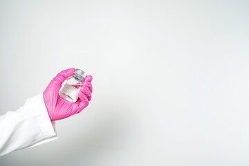 virus vaccine bottle for injection in hand of doctor or Technician scientist