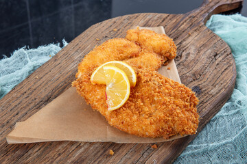 Fried Chicken schnitzel cordon bleu with cheese in breadcrumbs, restaurant food. Delicious tender...