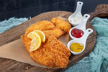 Fried Chicken schnitzel cordon bleu with cheese in breadcrumbs, restaurant food. Delicious tender...