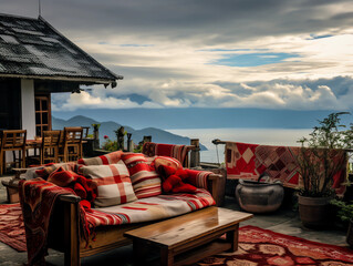A beautiful terrace with a sofa and coffee table overlooking the Andes mountains - Powered by Adobe