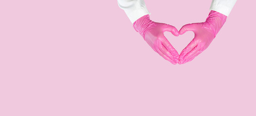 Doctor hands with surgical gloves forming a heart concept of love and hope in medicine
