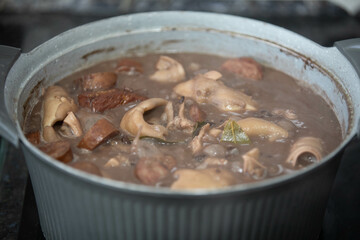 Traditional and irresistible Brazilian feijoada closeup