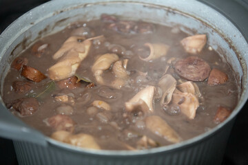 Traditional and irresistible Brazilian feijoada closeup