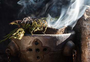 Juniper wood while burning. Nepal people used it for the ritual purification of temples. The...