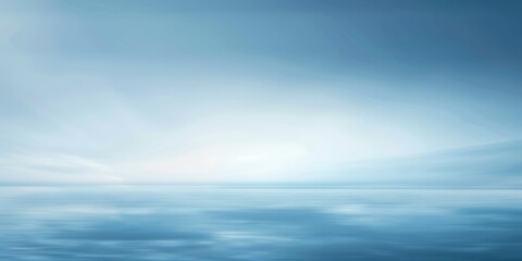 A blue sky with a calm ocean in the background