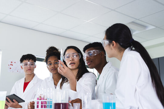 Diverse students engage in a science experiment at high school