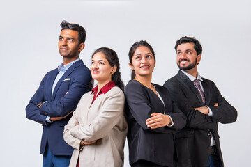 Indian asian young business professionals executive standing in group and looking at camera