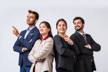 Indian asian young business professionals executive standing in group and looking at camera