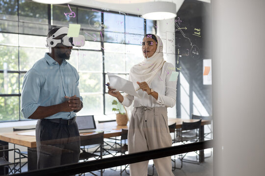 In modern business office, diverse team working together