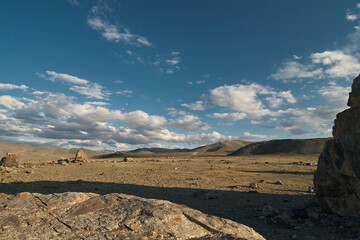 Huge stones among the steppe plain