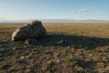 Huge stones among the steppe plain