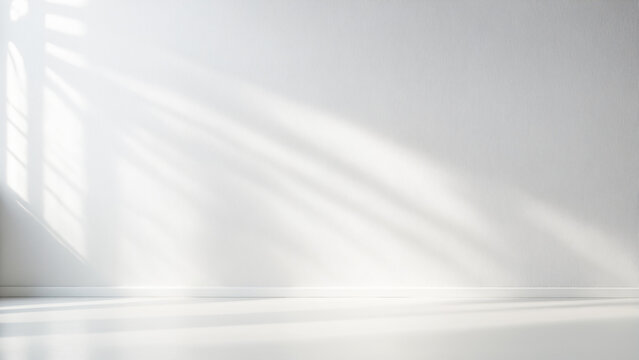 Fototapeta Minimalistic light background with blurred foliage shadow on white wall