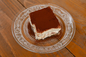 Tiramisu dessert on a decorative glass plate