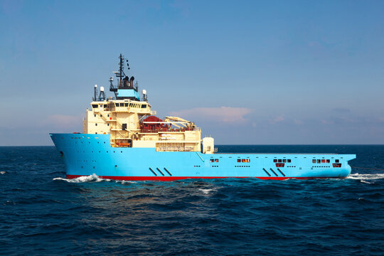Offshore supply vessel on the move at sea.