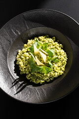 Bulgur Snack with Basil, Parsley, Lemon, and Olive Oil Sauce, Accompanied by Cheese. Contemporary Healthy Cooking Concept. Sunlight, Selective Focus