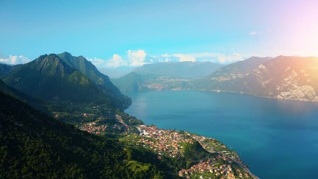 Aerial view of Italian town of Limone Sul Garda on Lake Garda, Italy. Limone Town in Italy on the Lake Garda, beautiful mountain views, old town red roofs, green lake.