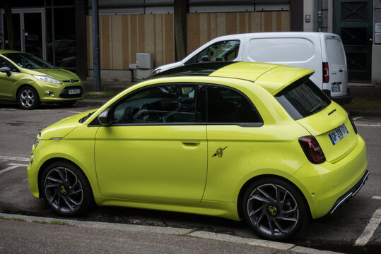 Mulhouse - France - 31 May 2024 - profile view of yellow fiat abarth 595 parked in the street