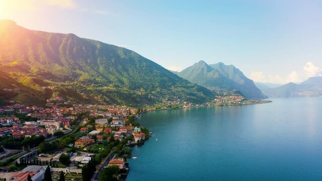 Aerial view of Italian town of Limone Sul Garda on Lake Garda, Italy. Limone Town in Italy on the Lake Garda, beautiful mountain views, old town red roofs, green lake.