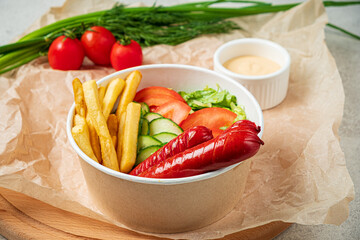 sausage with french fries and vegetables