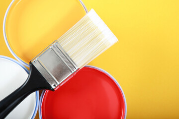 Paint cans and paint brushes and how to choose the perfect interior paint color