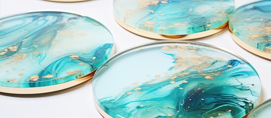 Epoxy resin products like wall panels and jewelry stands are handcrafted and displayed on a white background in the copy space image.