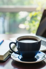 Black Coffee Cup On Office Desk With Open Notebook And Laptop