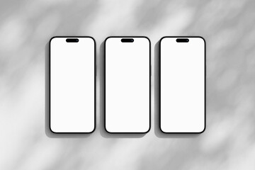 Three iPhone mobile phones with blank screen