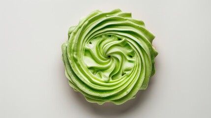 Obraz premium Green vanilla cookie with cream seen from above on a white background