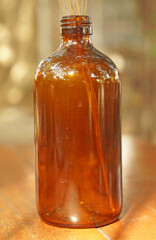 Closeup bottle with brown wooden table - vintage Patterns 