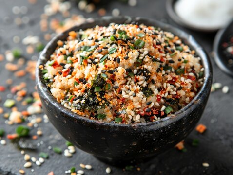 Furikake is a Japanese seasoning made from a mixture of dried and ground ingredients in bowl