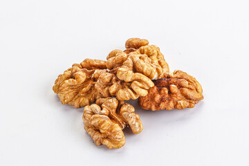 Cracked kernel walnut heap isolated