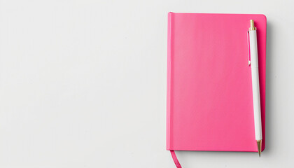 A pink notebook in the bottom right corner of a solid white background, ready for taking notes.