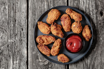 american style fried chicken wings on a plate