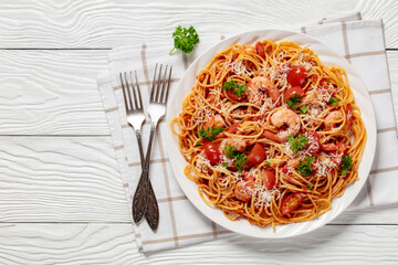 shrimp fra diavolo with spaghetti on a plate