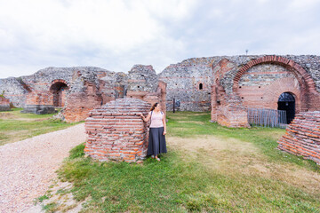 Woman tourist visit archaeological site, remains of palace Felix Romuliana, Gamzigrad, location of...