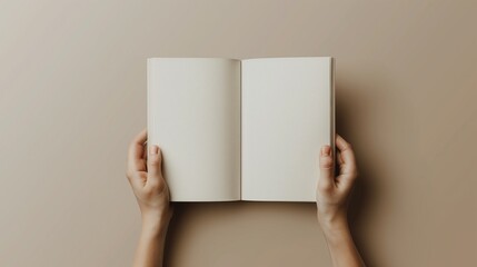 A person holding an open book in their hands