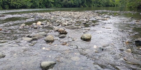 rocks in a river in rural Indonesia