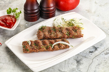Kebab with beef served onion