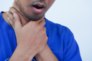 Sore Throat. Closeup Handsome man Hands And Neck. Throat Pain. He had a sore throat and touched his...