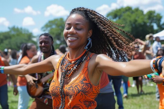 People dancing to Afrobeat music at a Juneteenth festival