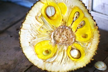 Inside of ripe jackfruit with the sap and seed, exotic fruit with unique scent
