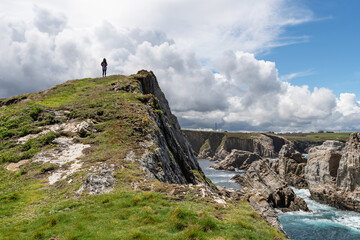 Fototapeta premium Hiker in Castro Cabo Blanco. Council of El Franco, Asturias