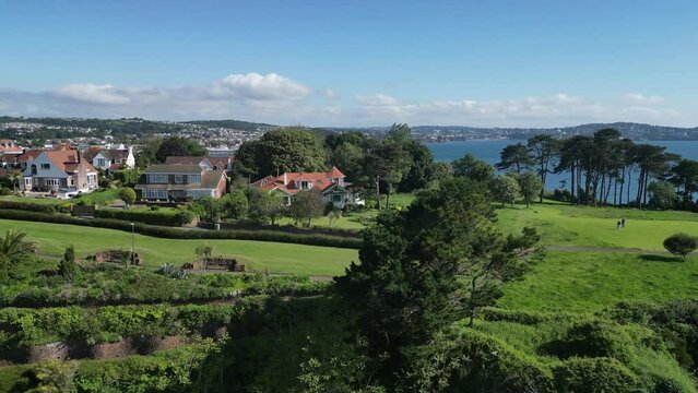 Paignton, Torbay, South Devon, England: DRONE VIEWS: A reveal shot of Paignton Pier, Harbour and Torbay. Torbay is a popular English holiday destination and a magnet for sailing enthusiasts.