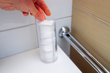 Cotton pad dispenser made of plastic glass