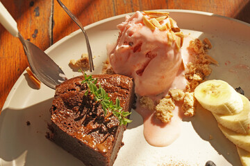 Strawberry Icescream with cake on the dish 