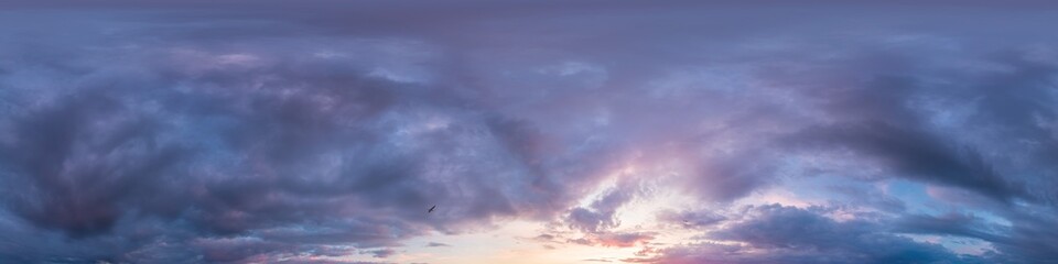 Dramatic Sunset sky 360 panorama. Vibrant sky panorama with bright glowing red pink Cumulus clouds. HDR 360 seamless spherical panorama. Sky dome for aerial drone panoramas. Climate and weather change