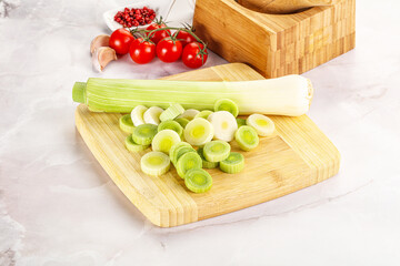 Ripe sliced leek over board