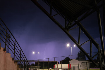 lightning at night in an outdoor park in an urban environment