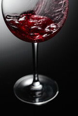 Closeup of red wine pouring.