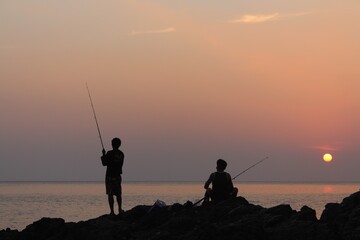 fishing at sunset